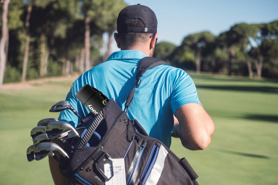 Golfer walking with golf bag on back